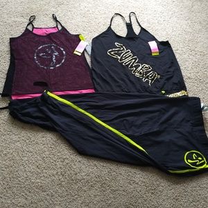 Zumba lot. All NWT, never worn. 2 xl tanks, 1 l jogger pants.